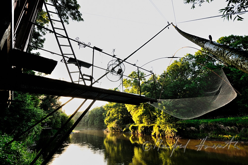 fishing hut with a fishing net on a crane