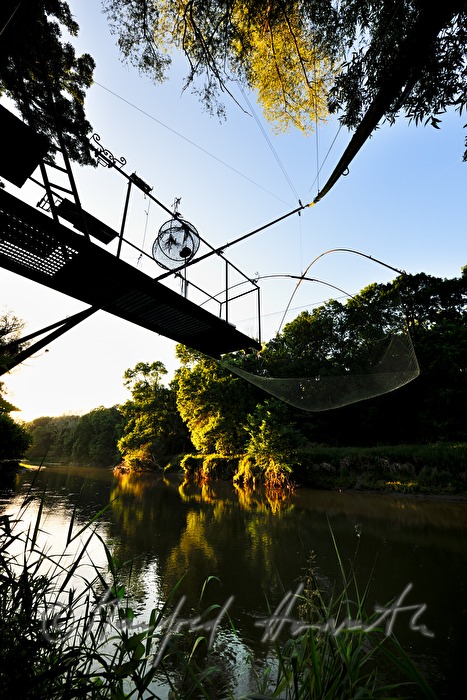 fishing hut with a fishing net on a crane