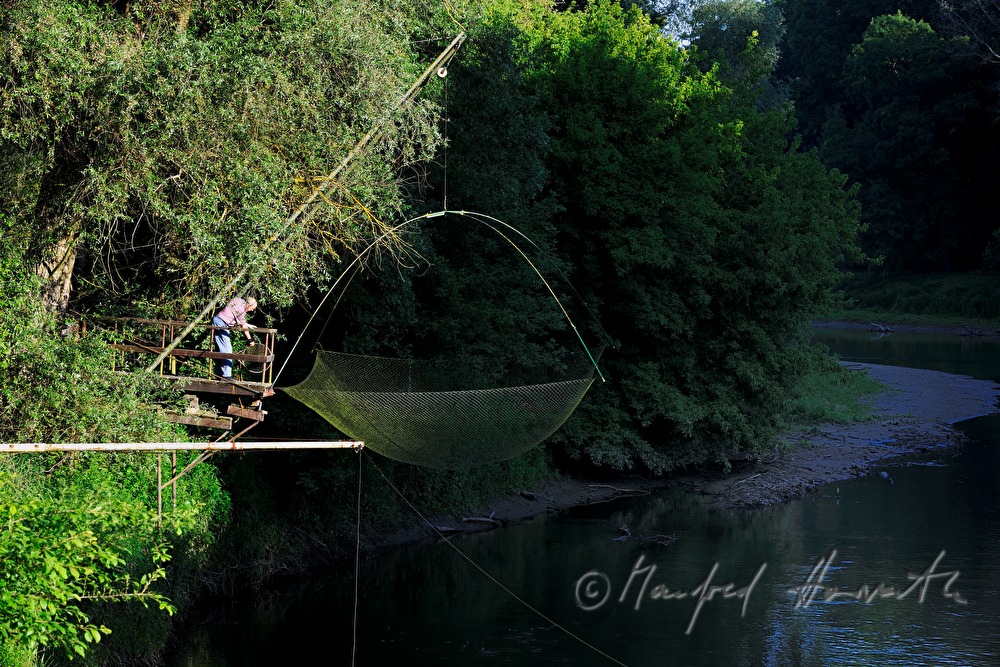 fishing hut with a fishing net on a crane