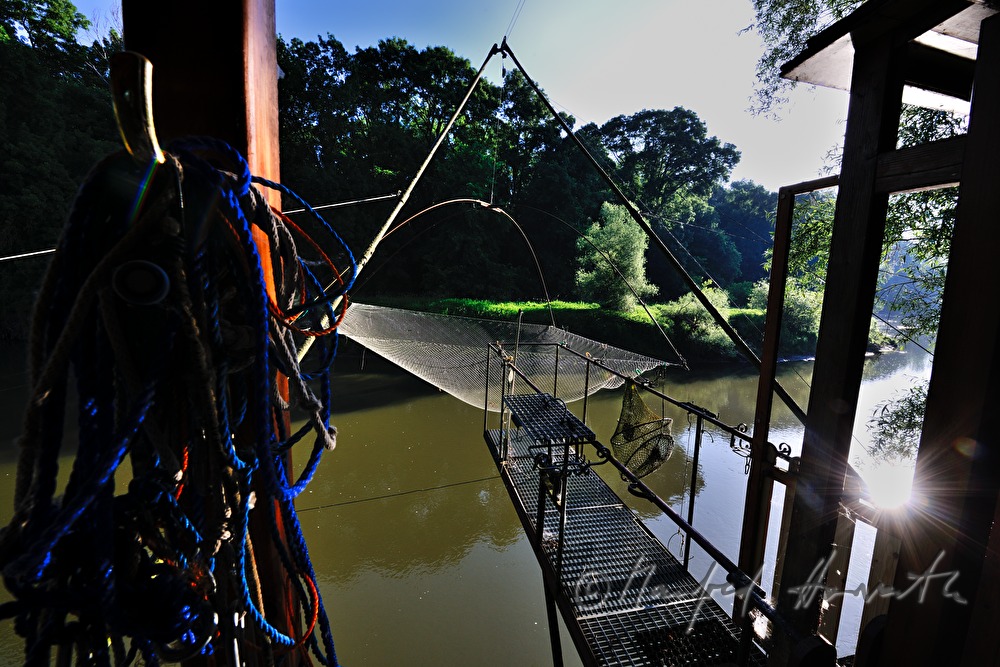 fishing hut with a fishing net on a crane