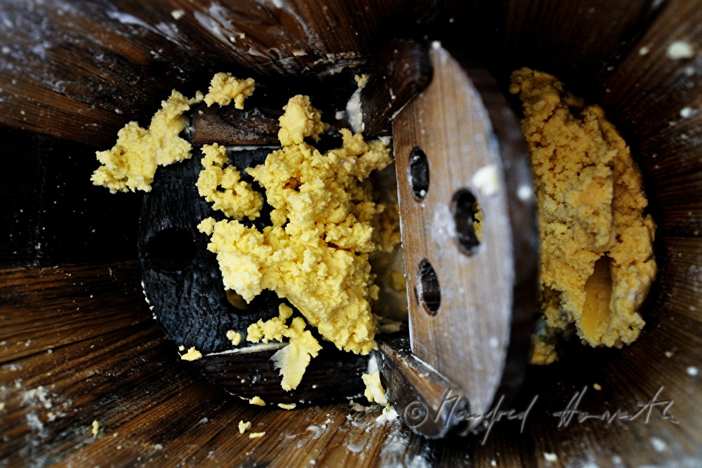 dairyman makes butter in the chum