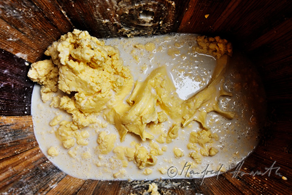 dairyman makes butter in the chum