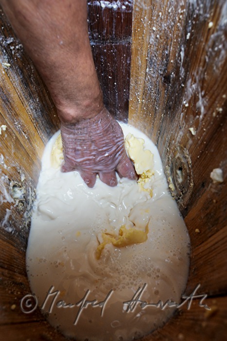 dairyman makes butter in the chum