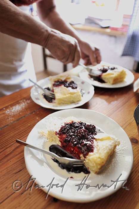 dairymaid with cherries in the kitchen