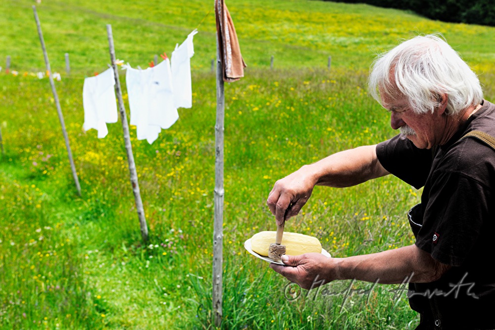 dairyman makes butter by hand