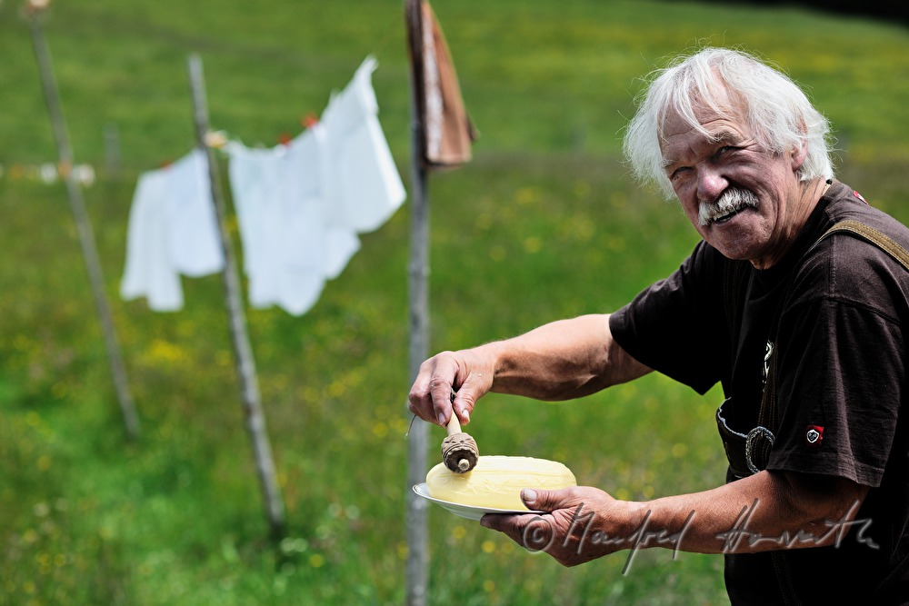 dairyman makes butter by hand