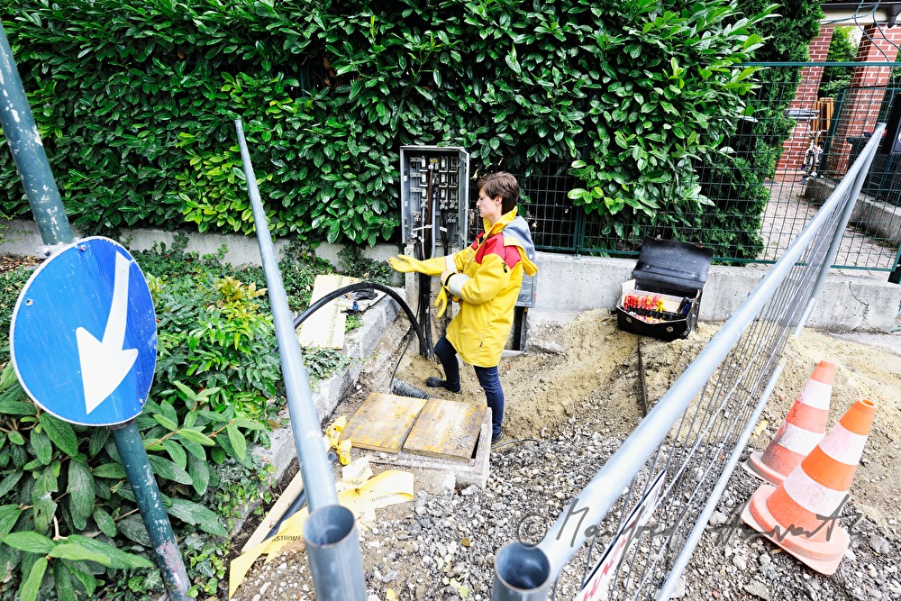 woman electrician installing a power connector