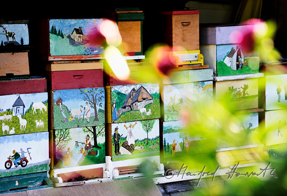 colourful painted beehives in slovenian style