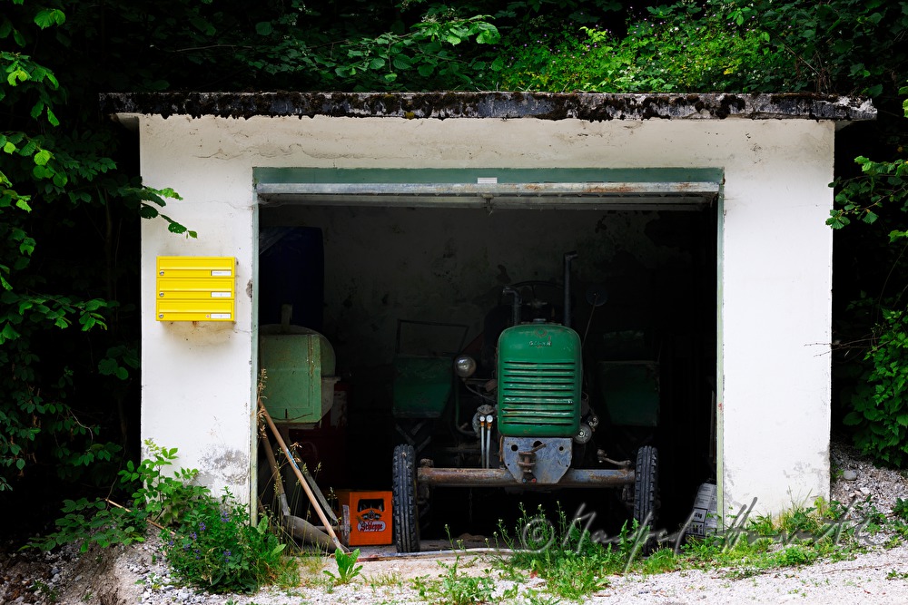 tractor in the garage near the forest