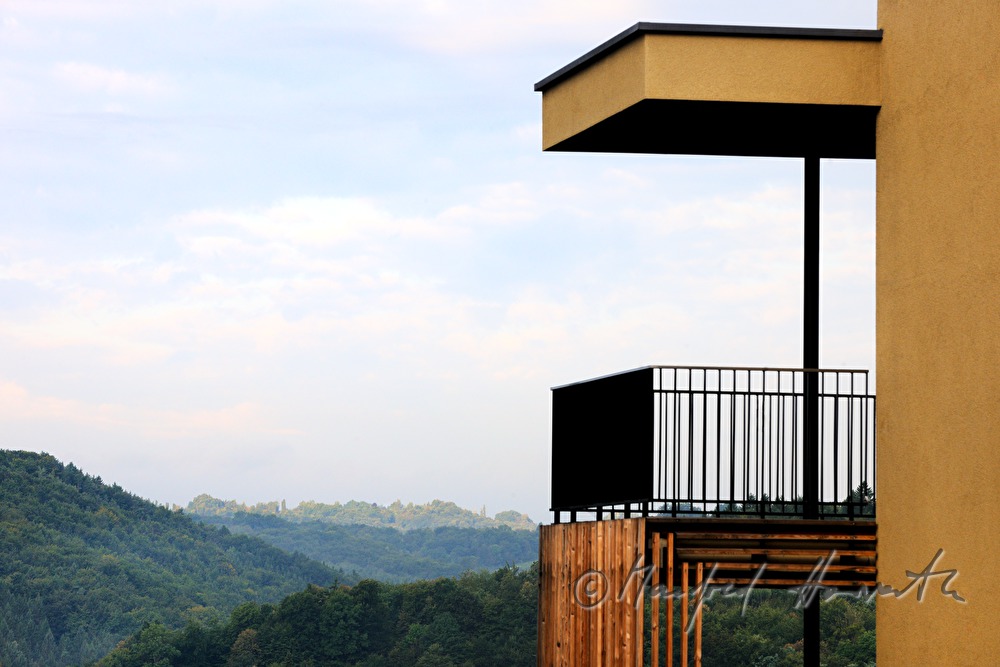 view from a balcony to the hilly landscape