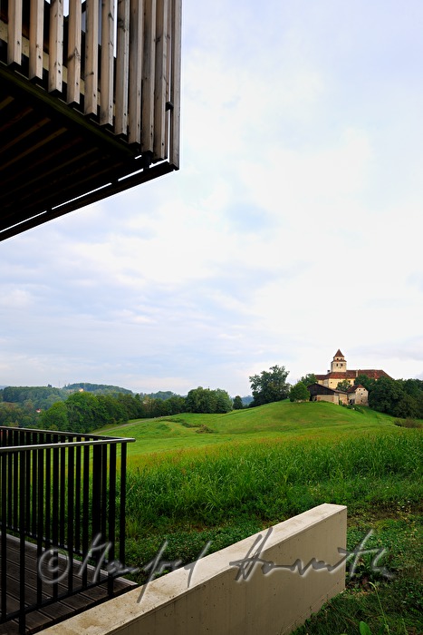 view from a balcony to the hilly landscape
