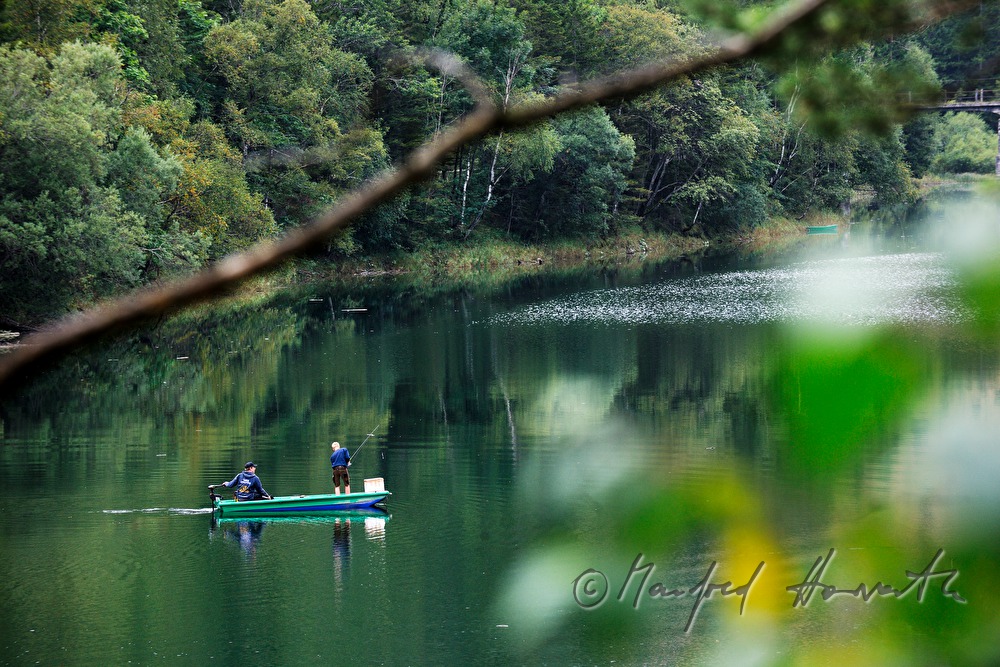 fishers in a motor boat