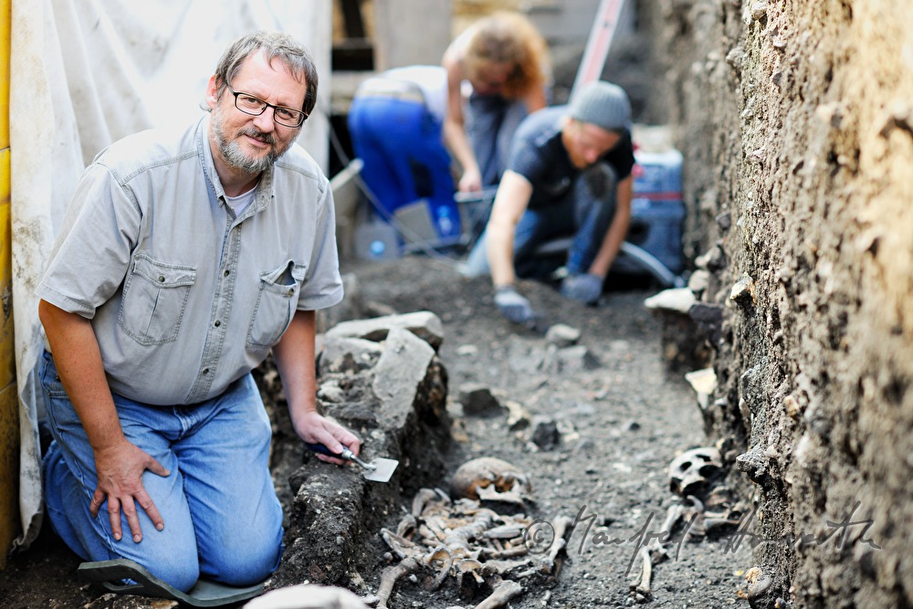 archaeologists uncovering a medieval cemetery