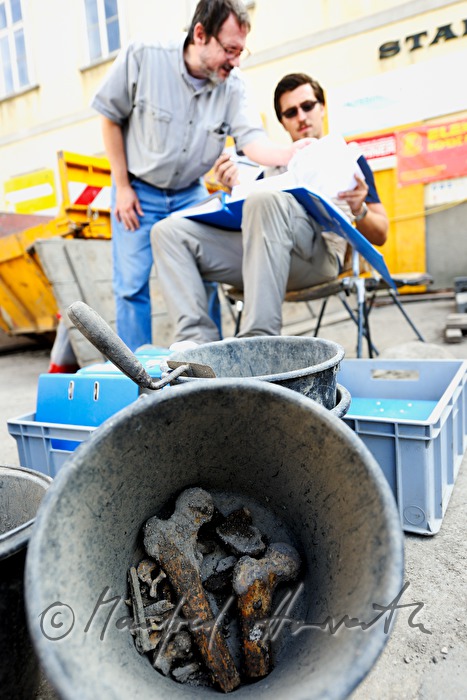 archaeologists uncovering a medieval cemetery