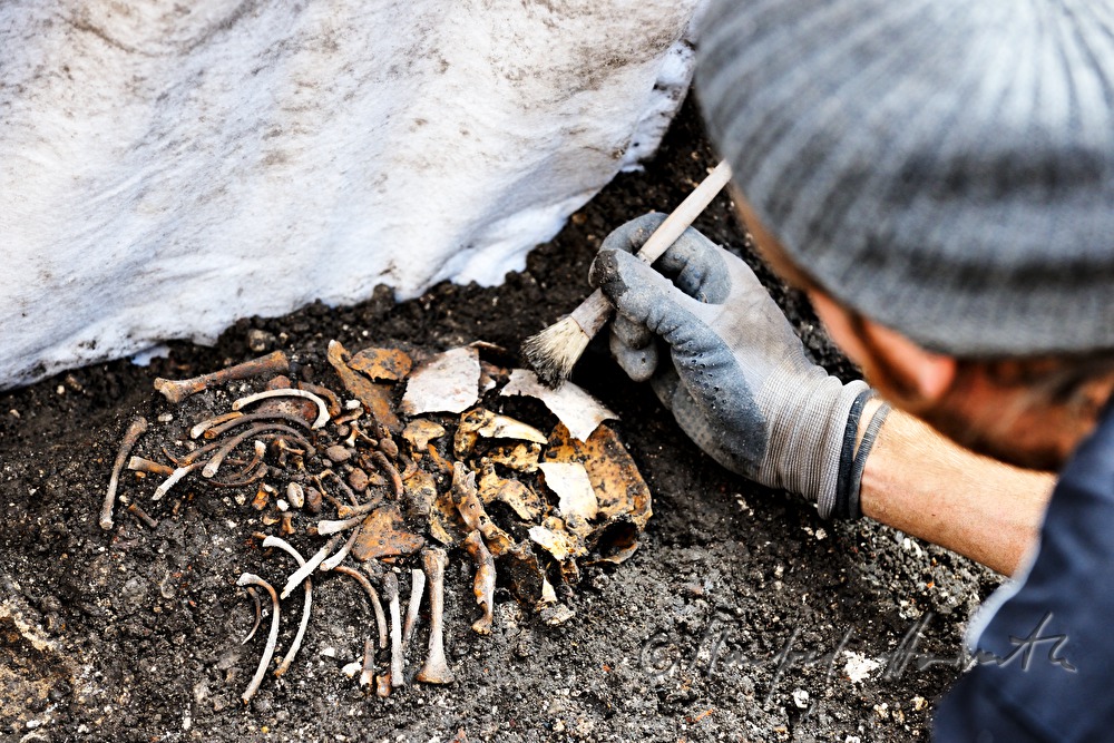 archaeologists uncovering a medieval cemetery