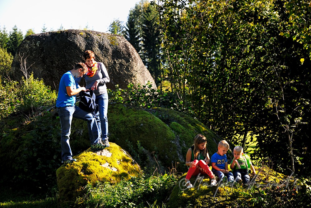 family making a break near the boulder