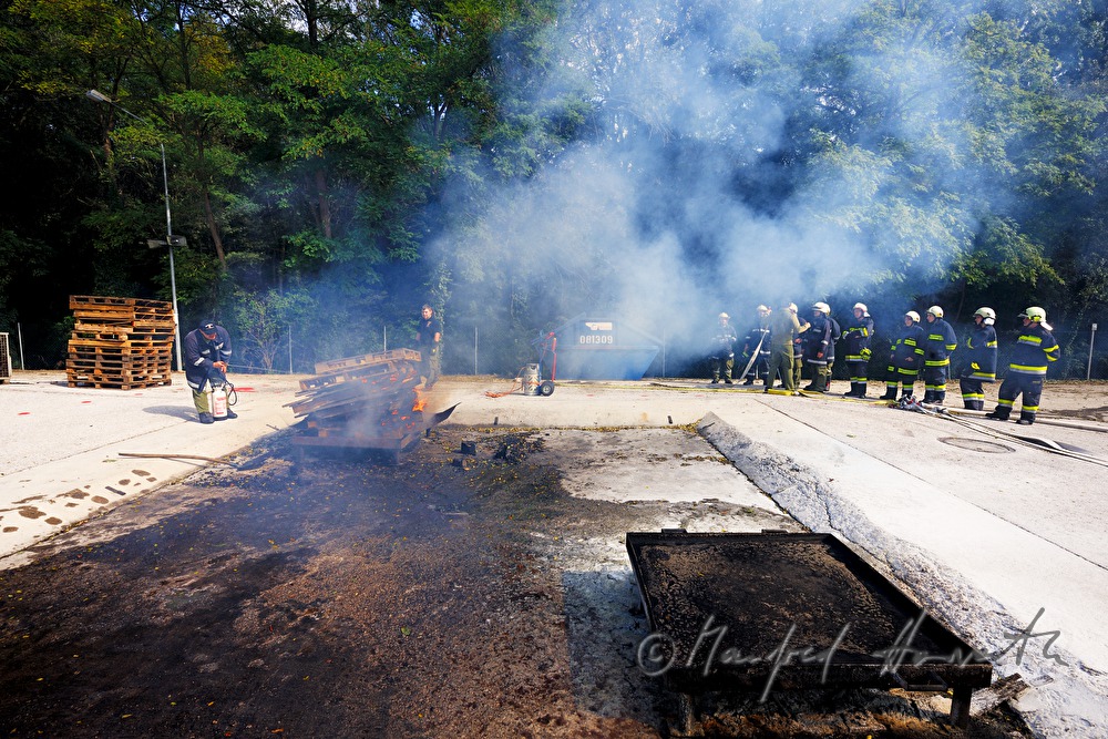 fireman distinguishing a fire for training