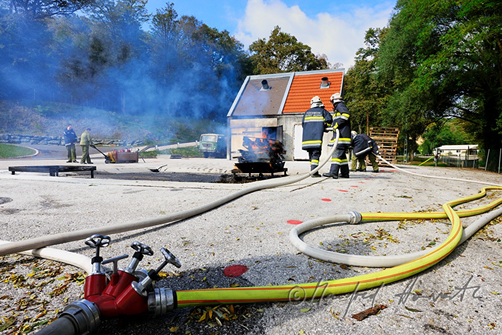 fireman distinguishing a fire for training