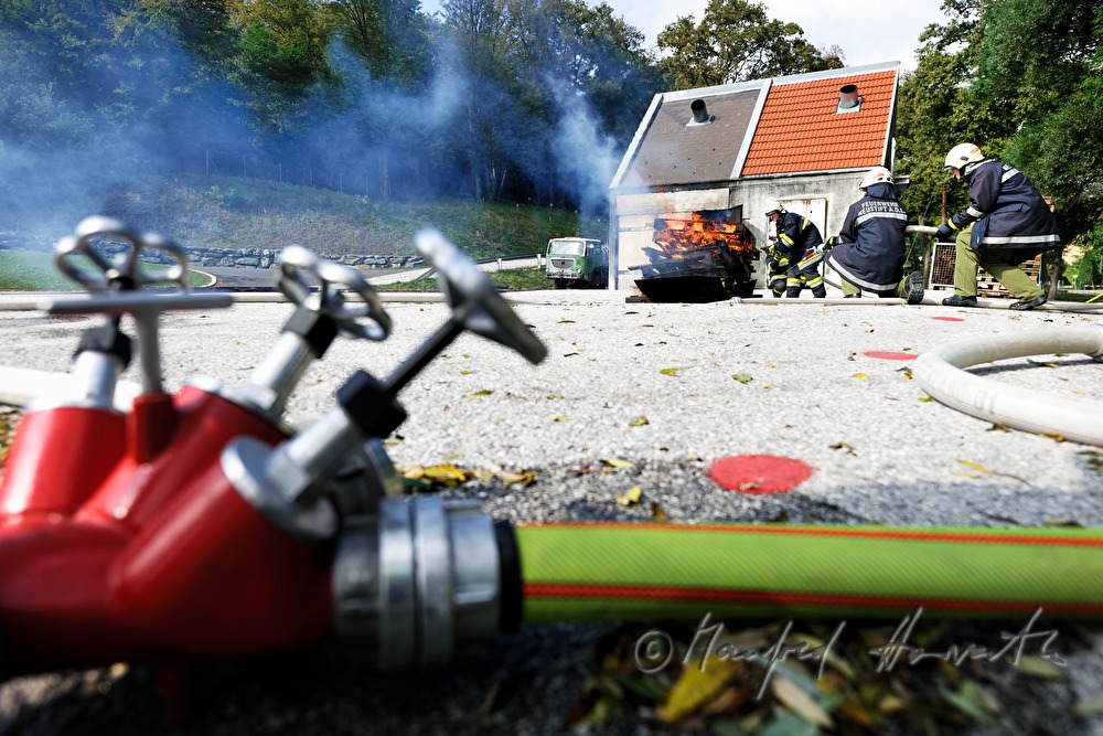 fireman distinguishing a fire for training