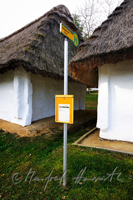 bus stop near the mud-walled wine cellars