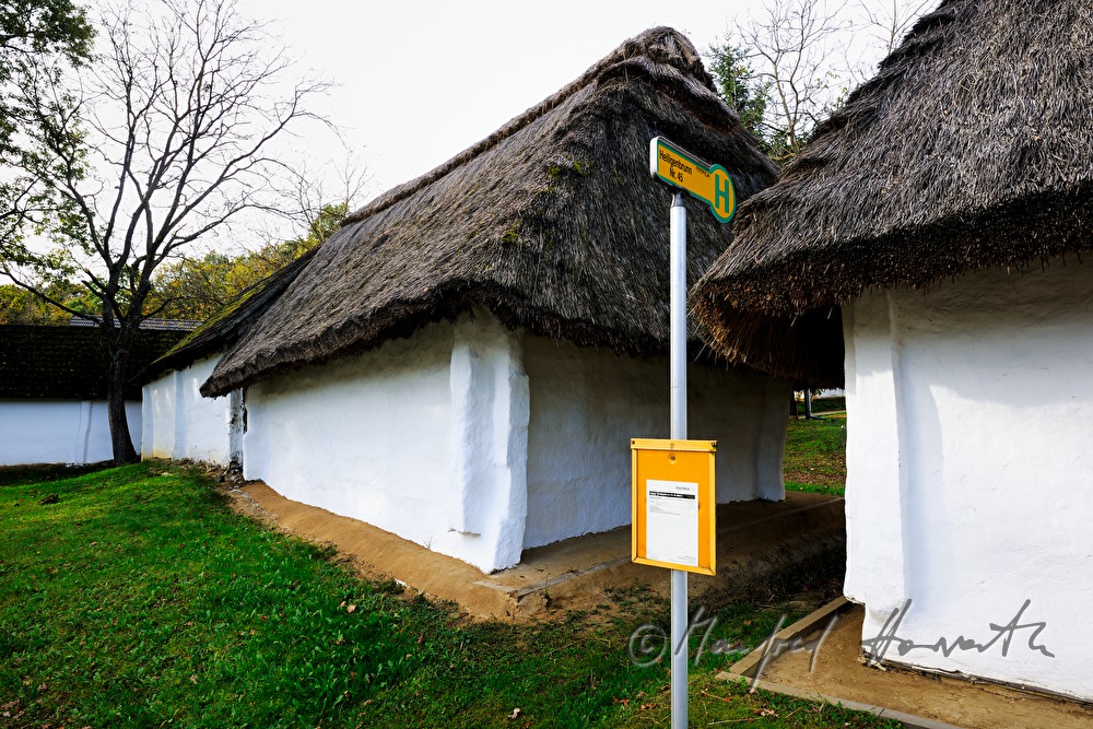 bus stop near the mud-walled wine cellars