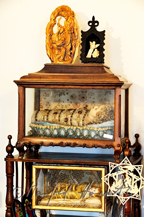 swaddled new born Christ dressed in brocade