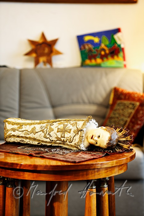 swaddled new born Christ dressed in brocade