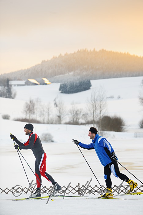 cross-country skiers in the ski trail