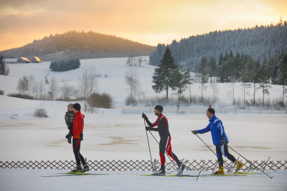 cross-country skiers in the ski trail