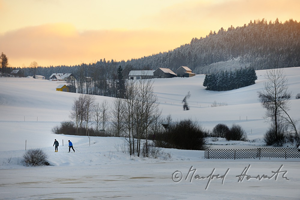 cross-country skiers in the ski trail