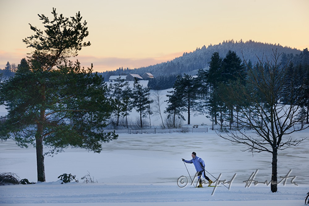 cross-country skiers in the ski trail