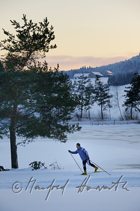 cross-country skiers in the ski trail