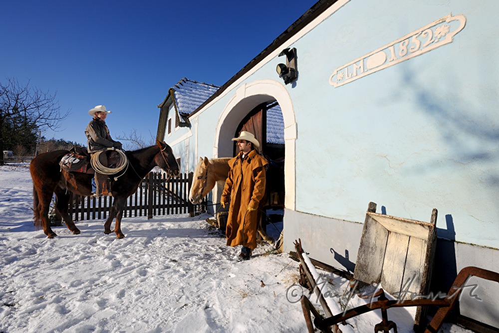 operators of the Ranch riding near their farm house