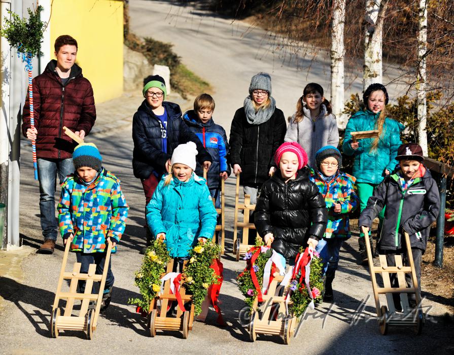 a group of children making ado with their ratchets
