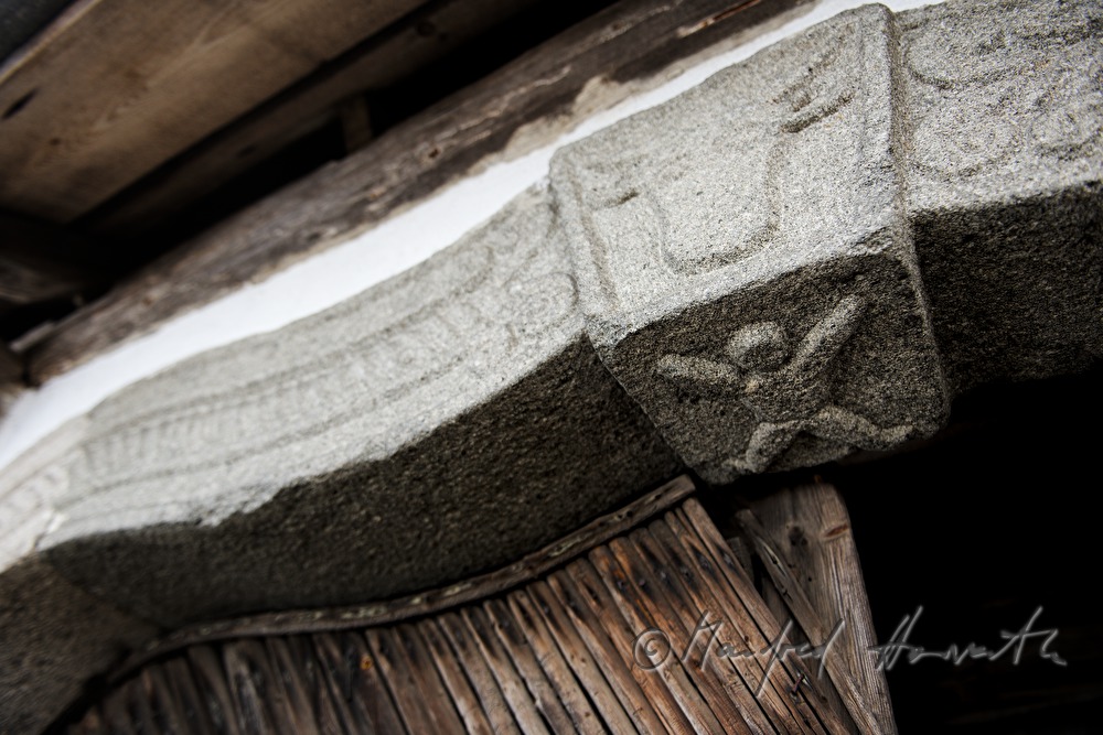 symbols in the archway of the barn