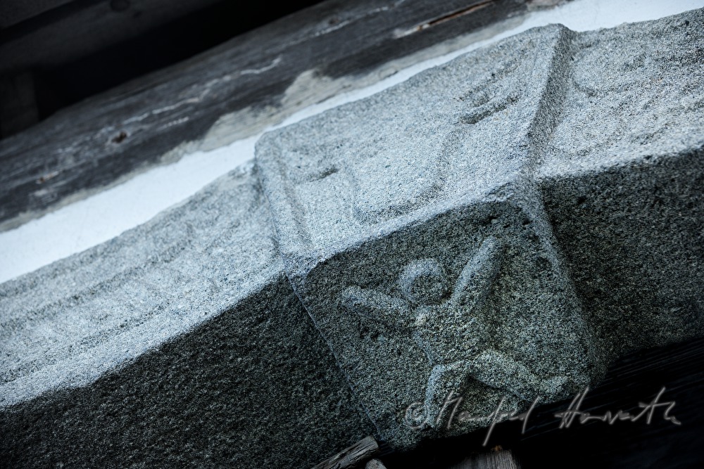symbols in the archway of the barn