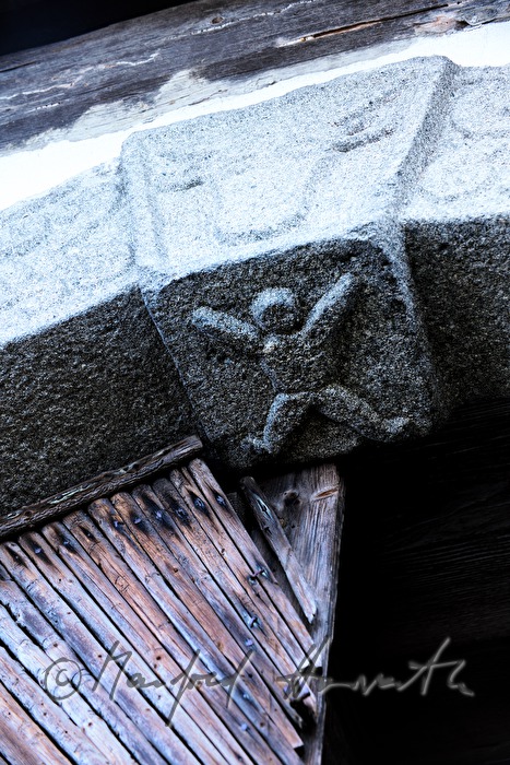 symbols in the archway of the barn