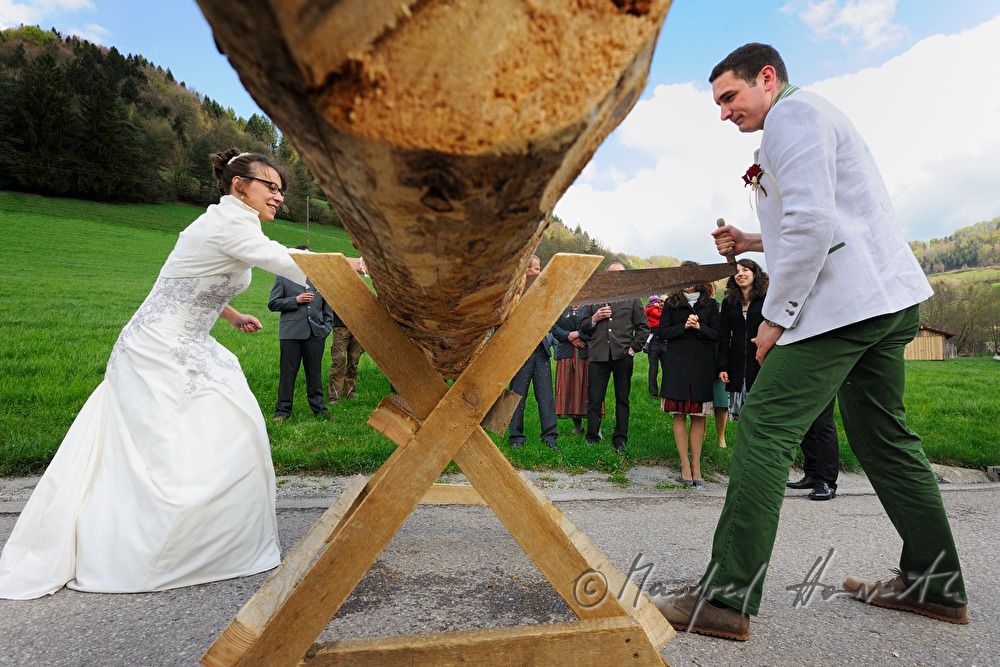 bridal couple stopped on the way to church for a saw job