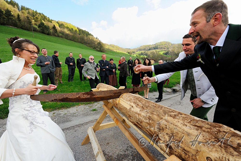 bridal couple stopped on the way to church for a saw job