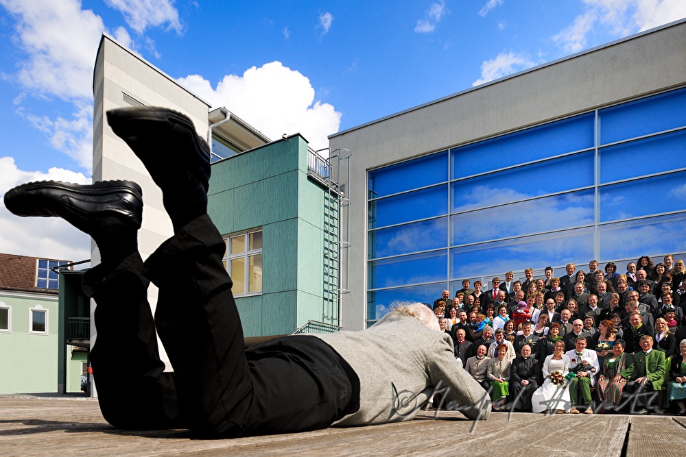 photographer takes a picture of a wedding party