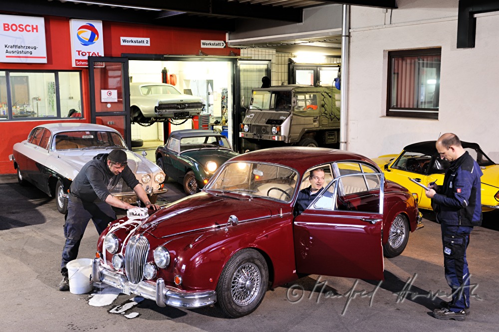mechanics checking a Jaguar MK2