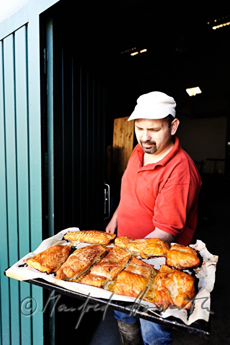 fisherman Helmut Schwarz smokes catfish