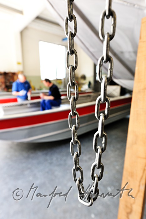 workers of the wharf building boats made of aluminium