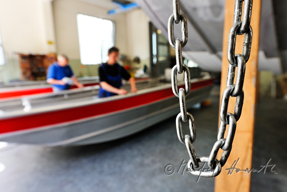 workers of the wharf building boats made of aluminium