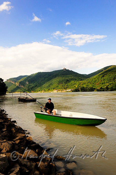 fisherman on the river shore of the Danube