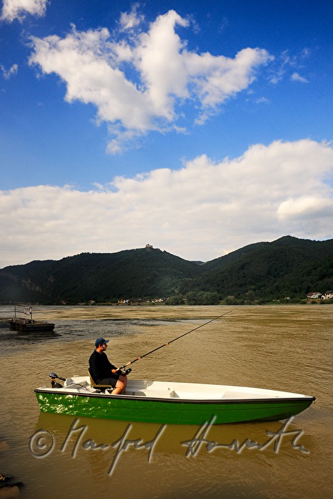 fisherman on the river shore of the Danube