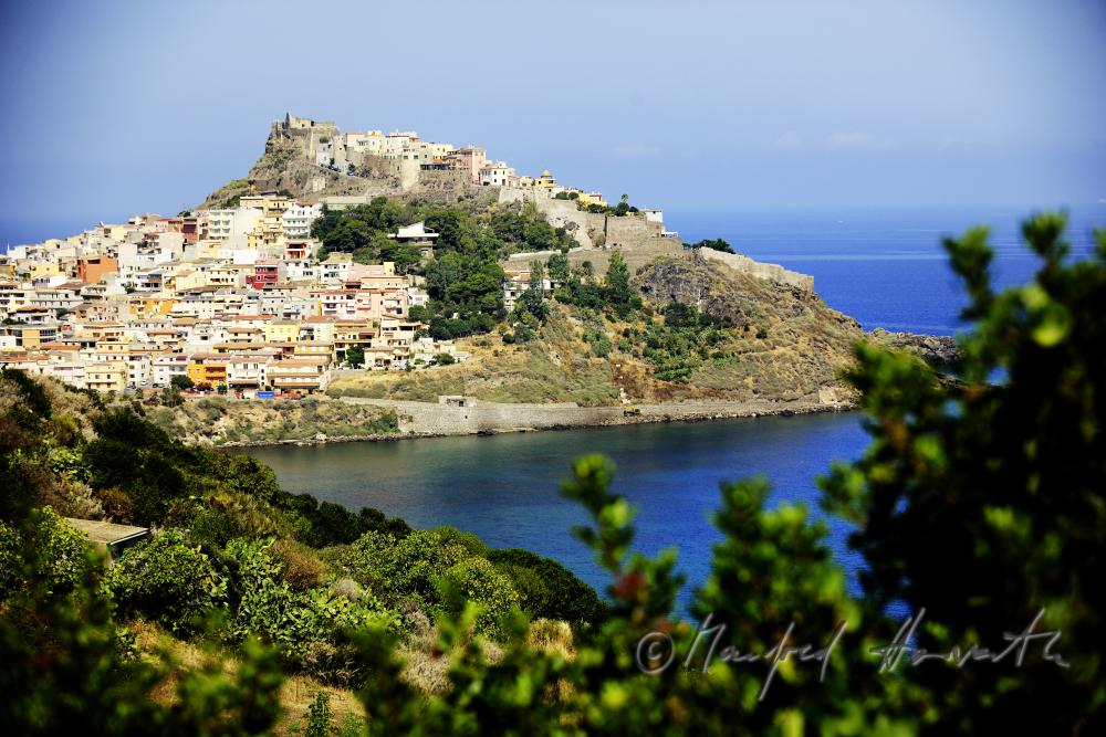 town on a cape with Castel Doria (Castel Castelgenovese)