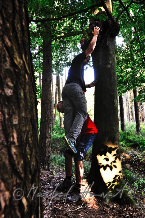 geocacher at the place of finding the geocache