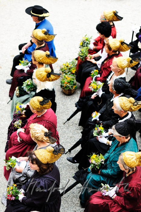 attendants of the open air mass in traditional clothes