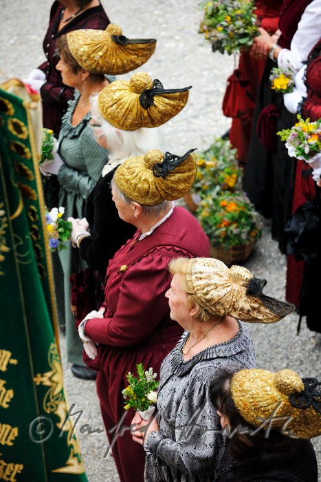 attendants of the open air mass in traditional clothes